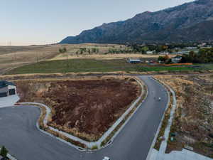 View of mountain backdrop with rural landscape