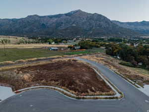 View of mountain backdrop featuring rural landscape