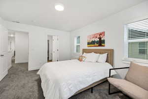 Carpeted bedroom with baseboards