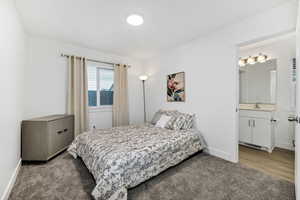 Carpeted bedroom with baseboards