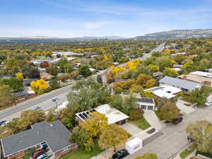 Aerial perspective of suburban area featuring a mountainous background