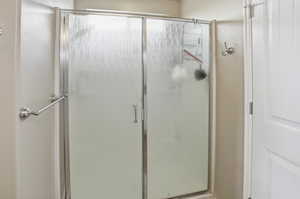 Full bath featuring a stall shower