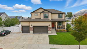 View of front of house featuring a gate, a porch, concrete driveway, a shingled roof, and stucco siding