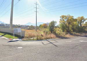 View of parking / parking lot with a mountain view