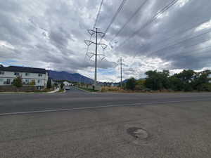 View of asphalt street with a mountain view