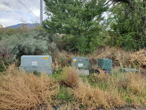 Exterior view of a pad mount transformer and a mountain backdrop