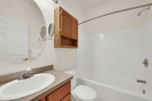 Full bathroom with shower / bathtub combination and vanity