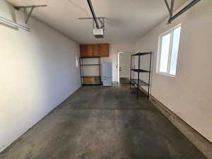 Garage featuring a garage door opener