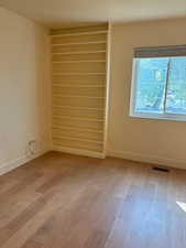 Empty room with light wood-style floors