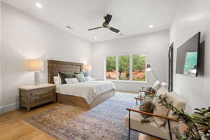 Bedroom featuring light wood finished floors, recessed lighting, and ceiling fan