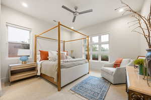 Bedroom with light colored carpet, a ceiling fan, and recessed lighting
