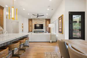 Dining space featuring light wood-style flooring, recessed lighting, and ceiling fan
