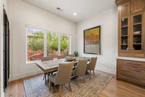 Dining space featuring light wood-style flooring and recessed lighting