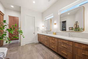 Full bath featuring double vanity and recessed lighting