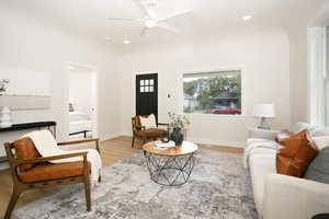Living room with recessed lighting, light wood-style floors, and ceiling fan