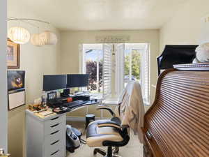Office/den space with carpeted floor-looks out to the street.