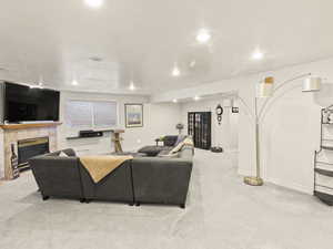 Downstairs living room with gas fireplace.