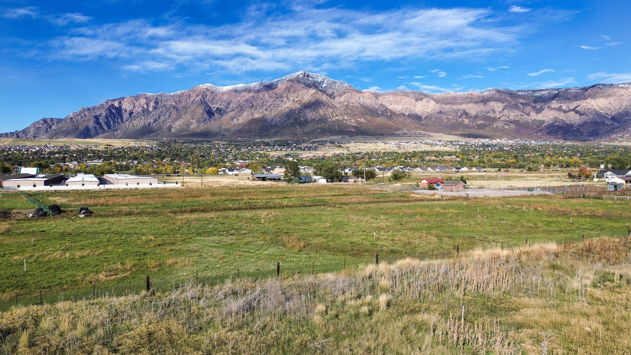 View of mountain backdrop with rural landscape