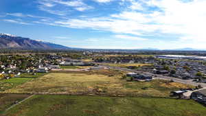 Aerial view of residential area featuring a mountain backdrop