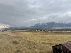 View of mountain backdrop with rural landscape
