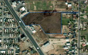 Aerial map of property and surrounding area featuring property parcel outlined