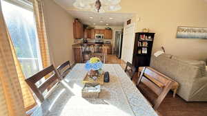 Dining area featuring recessed lighting and a chandelier