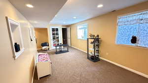 Workout area with carpet and recessed lighting