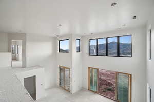 Unfurnished living room with a towering ceiling