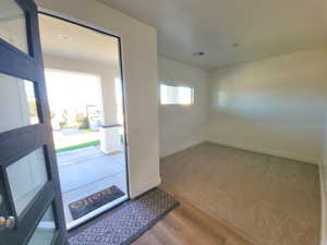Entryway featuring baseboards and light wood-style floors