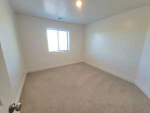 Unfurnished room featuring carpet flooring and baseboards