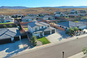 Aerial perspective of suburban area featuring a mountainous background