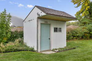 View of shed with a mountain view