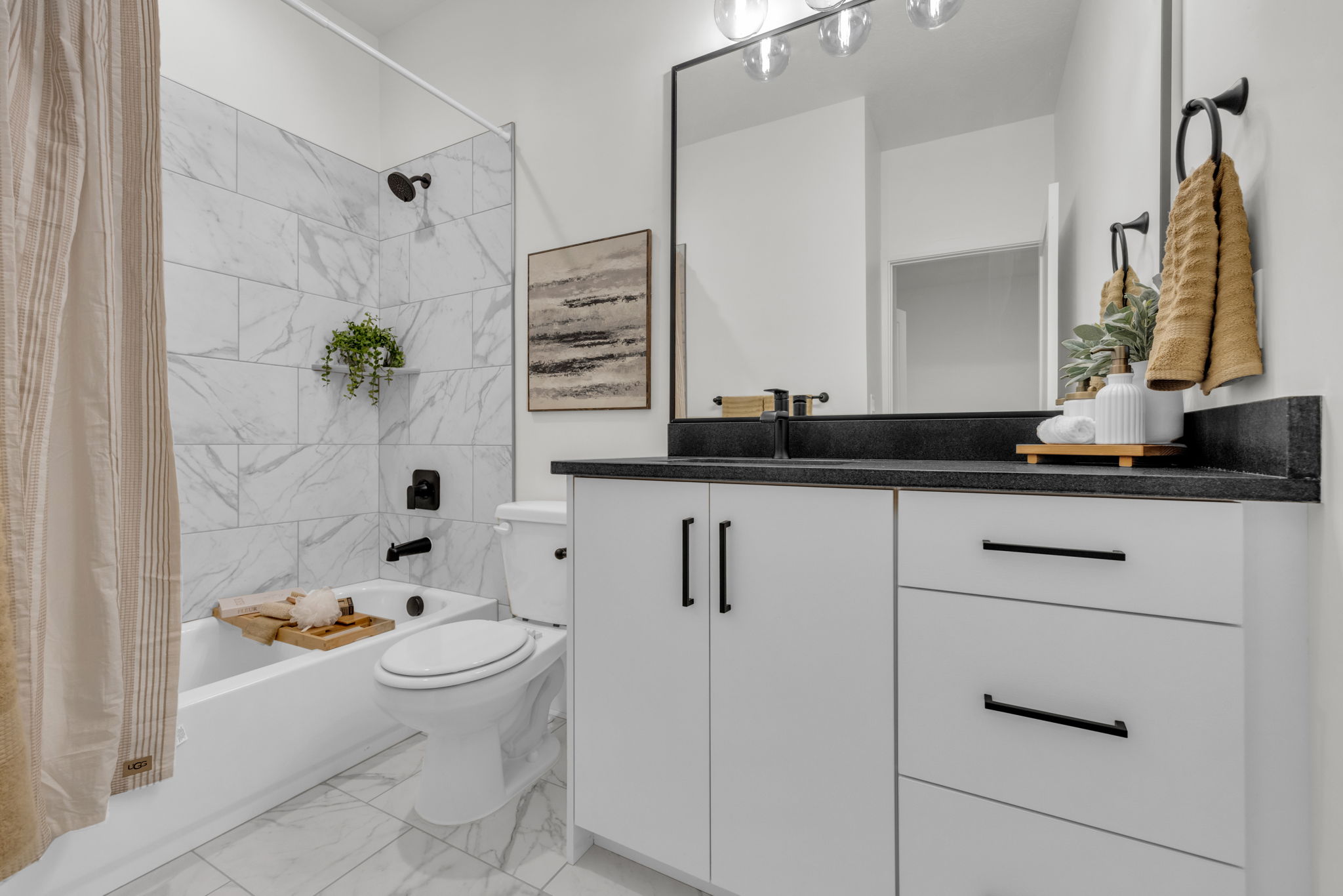 Bathroom with shower / bath combination with curtain, vanity, and light marble finish floors