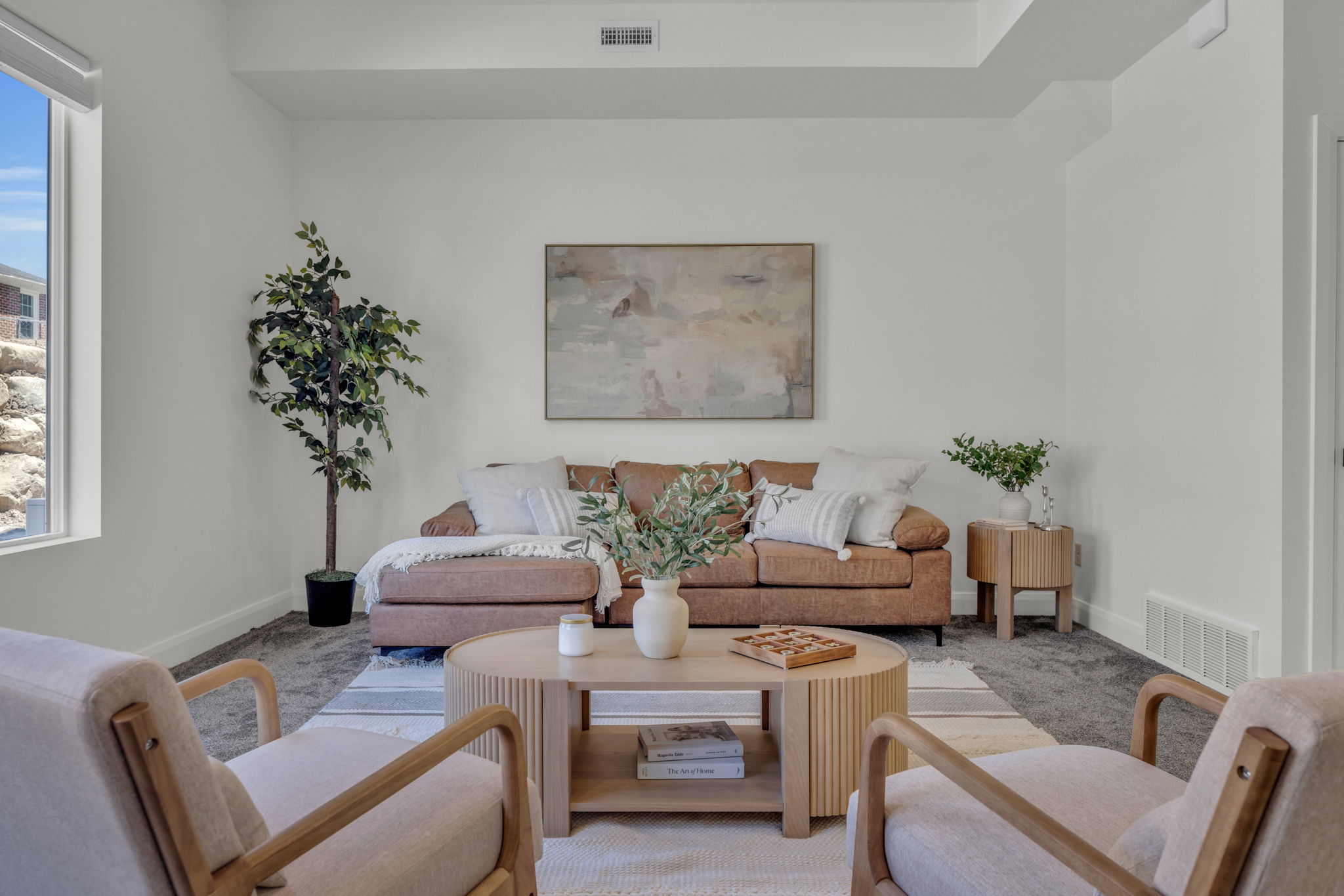 Living room with baseboards and carpet
