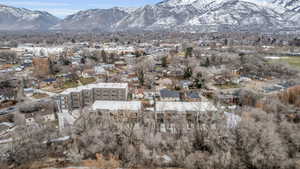 View of property location featuring mountains and nearby suburban area