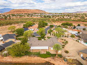 Aerial perspective of suburban area featuring a mountain backdrop