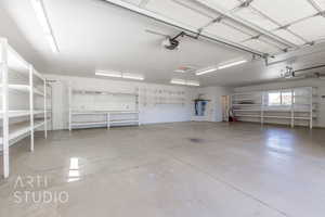 Garage with a garage door opener and electric water heater