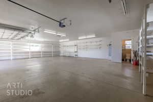 Garage featuring a garage door opener