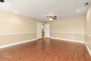 Unfurnished room featuring a ceiling fan, wood finished floors, and recessed lighting