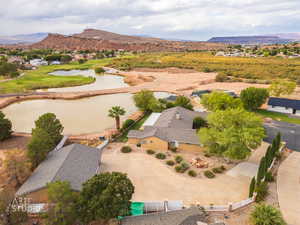 Aerial view of residential area with a water and mountain view and a local golf course