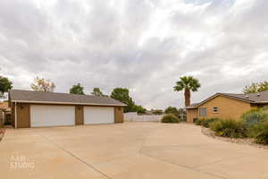 Detached garage featuring driveway