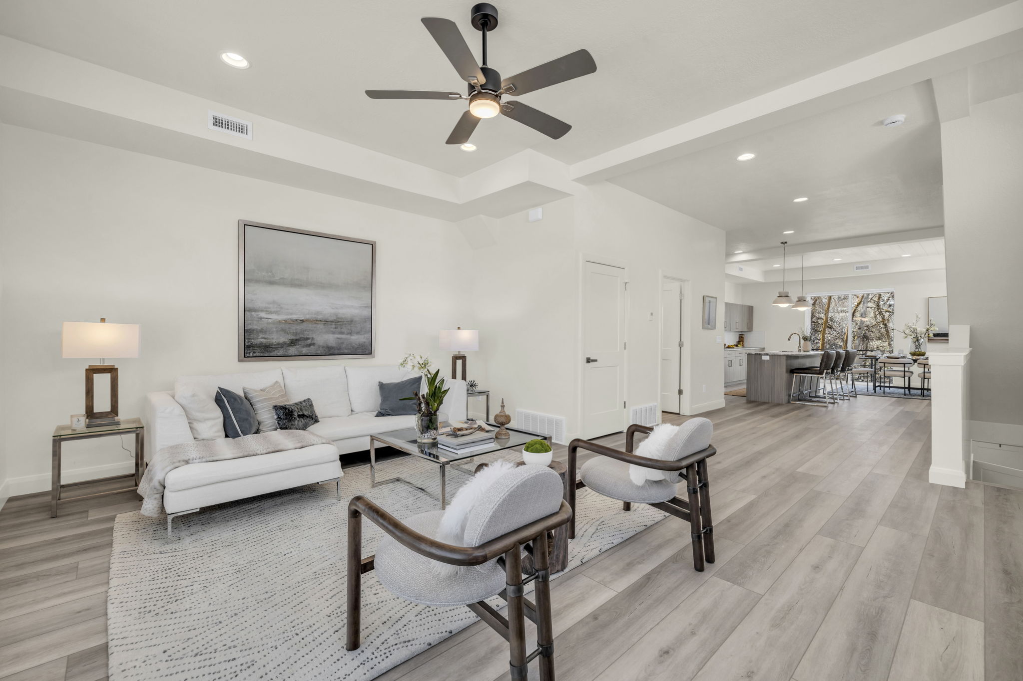 Living area featuring light wood-type flooring, recessed lighting, and ceiling fan