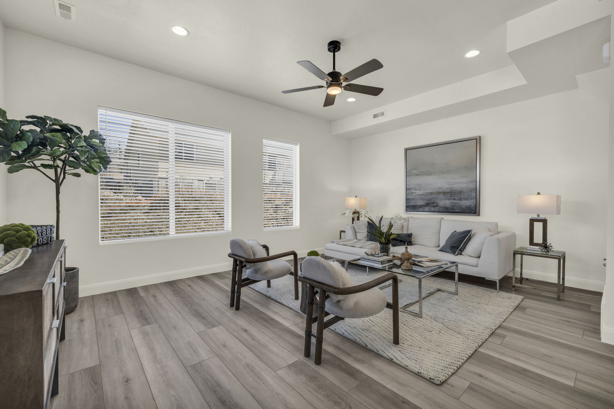 Living room with recessed lighting, light wood-style floors, and ceiling fan