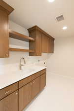 Laundry room featuring cabinet space, washer hookup, electric dryer hookup, and recessed lighting