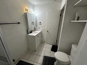 Fully remodeled three-quarter bathroom featuring a new walk-in shower, modern vanity, and tile flooring.