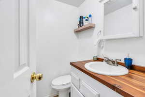 Bathroom featuring vanity and toilet