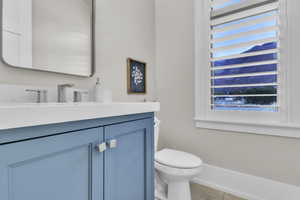 Bathroom with vanity and tile patterned floors
