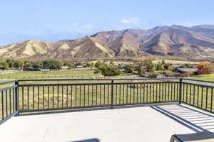 View of mountain backdrop featuring rural landscape and a pastoral area
