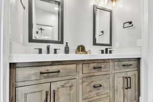 Full bath featuring double vanity