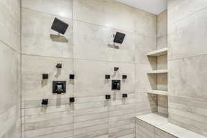Bathroom featuring tiled shower